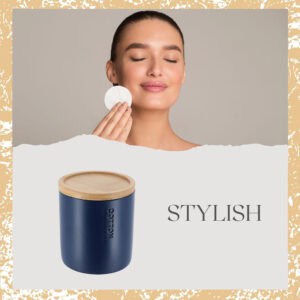 Stylish navy blue cotton jar with bamboo lid featured alongside a model using a cotton pad, highlighting its practical and aesthetic appeal.