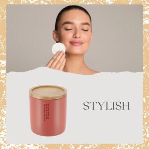 Stylish red cotton jar with bamboo lid featured alongside a model using a cotton pad, highlighting its practical and aesthetic appeal.