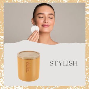 Stylish mustard yellow cotton jar with bamboo lid featured alongside a model using a cotton pad, highlighting its practical and aesthetic appeal.