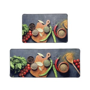 Set of two Fresh Ingredients kitchen mats on a plain white background, printed with basil, tomatoes, chili peppers, and spice bowls on a slate surface.