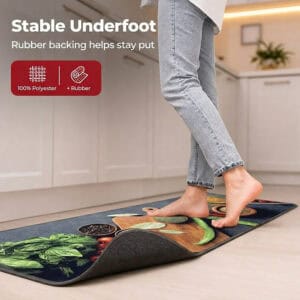 A bare foot steps onto the kitchen runner with one corner curled up to reveal the gray rubber backing, labeled one hundred percent polyester with rubber.