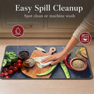 A hand wipes a brown spill from the kitchen mat with a white cloth, with icons showing the mat is spot clean and machine washable.