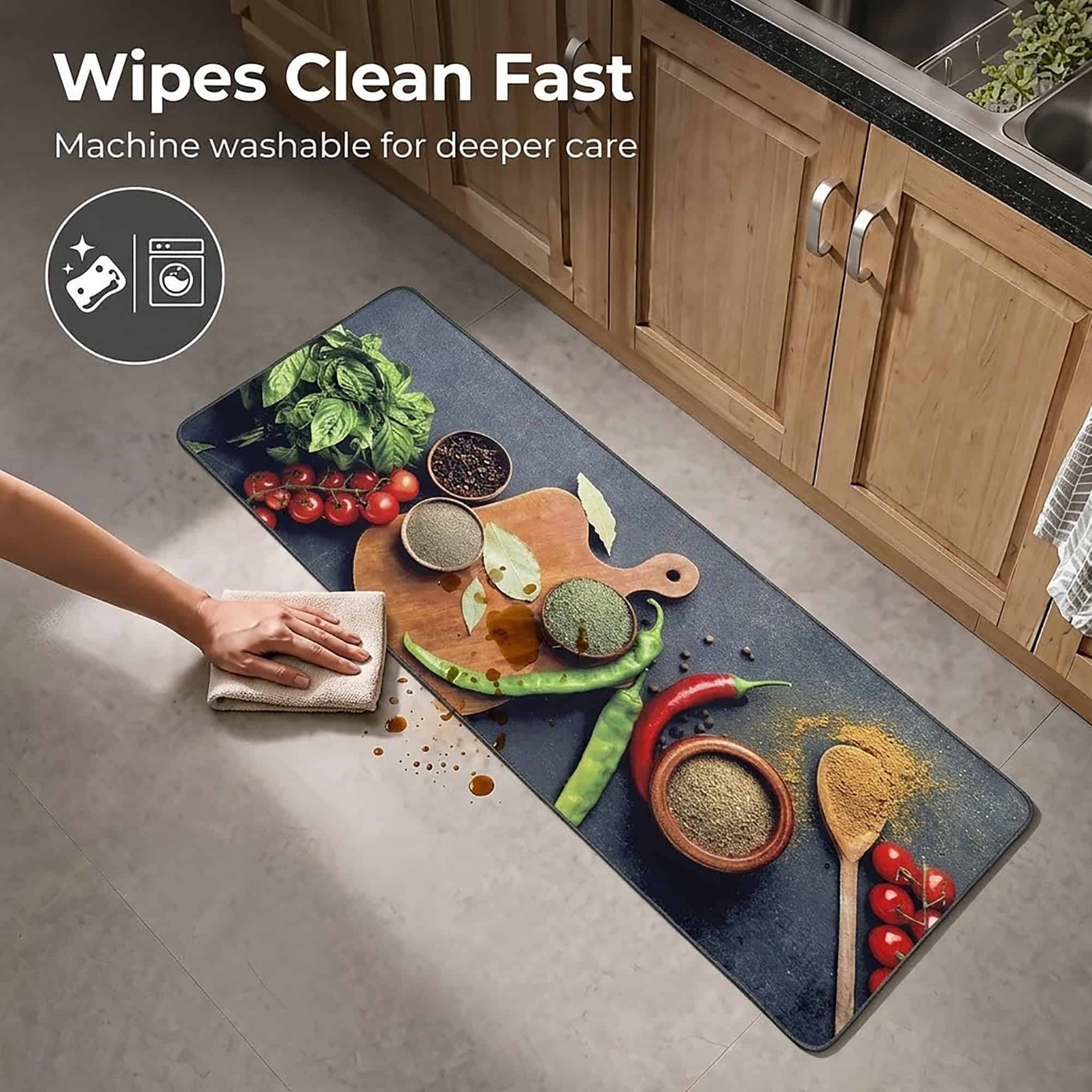 A hand wipes a brown spill from the long kitchen runner with a cloth, showing how the machine washable mat cleans up quickly.
