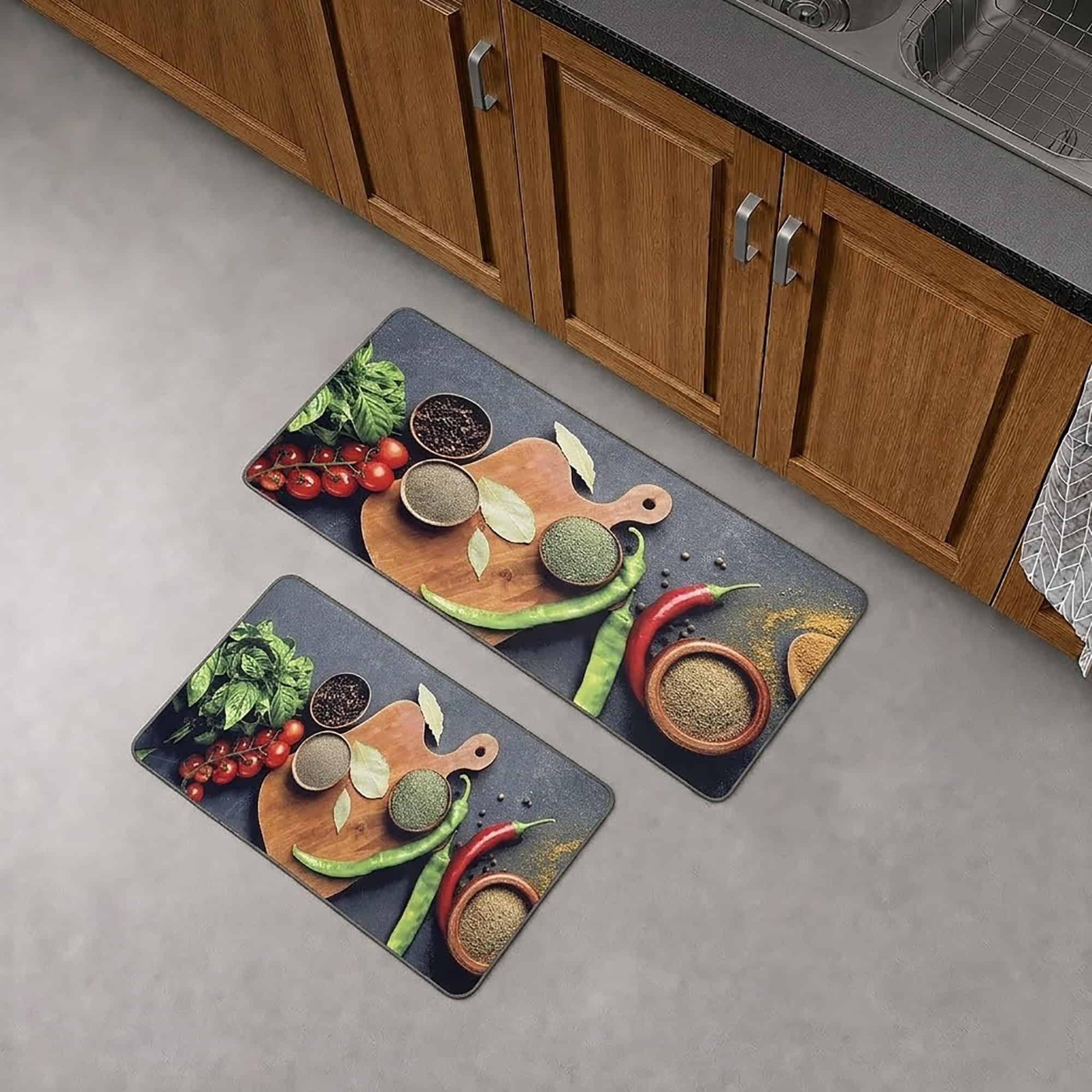 The runner and standard mat placed together on a gray floor in front of wood kitchen cabinets, showing both pieces of the set.