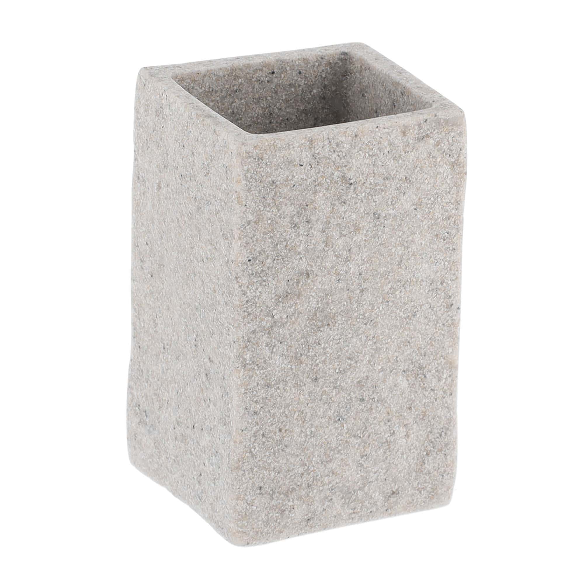 A close-up view of a gray bathroom tumbler with a stone-effect texture, showcasing its minimalist rectangular design.