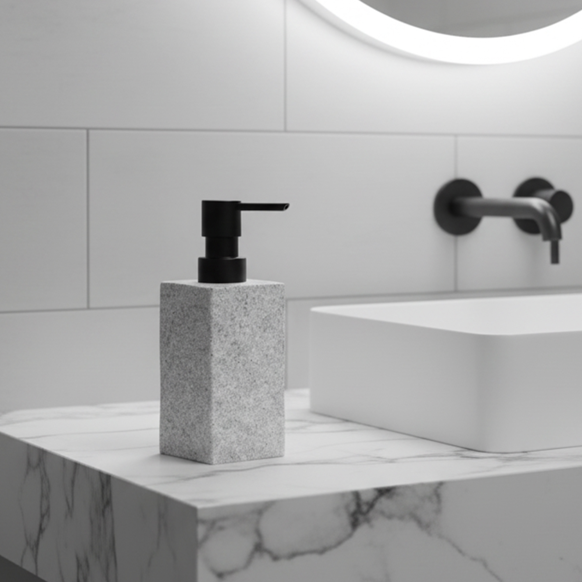 Gray stone effect bathroom accessories including soap dispenser tumbler soap dish and toothbrushes near sink