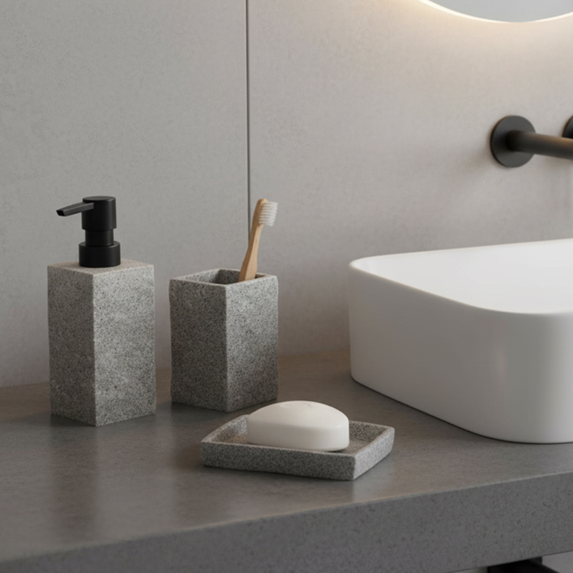 Gray stone effect soap dispenser with black pump on modern bathroom countertop