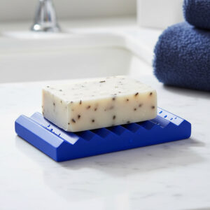 Blue ribbed soap dish holding bar soap on bathroom countertop