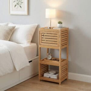 "Bamboo storage cabinet with louvered door and two open shelves styled as a bedside table with lamp and clock"