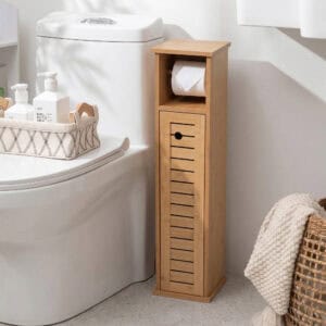 "Bamboo storage cabinet with vented door beside toilet, holding toilet paper roll"