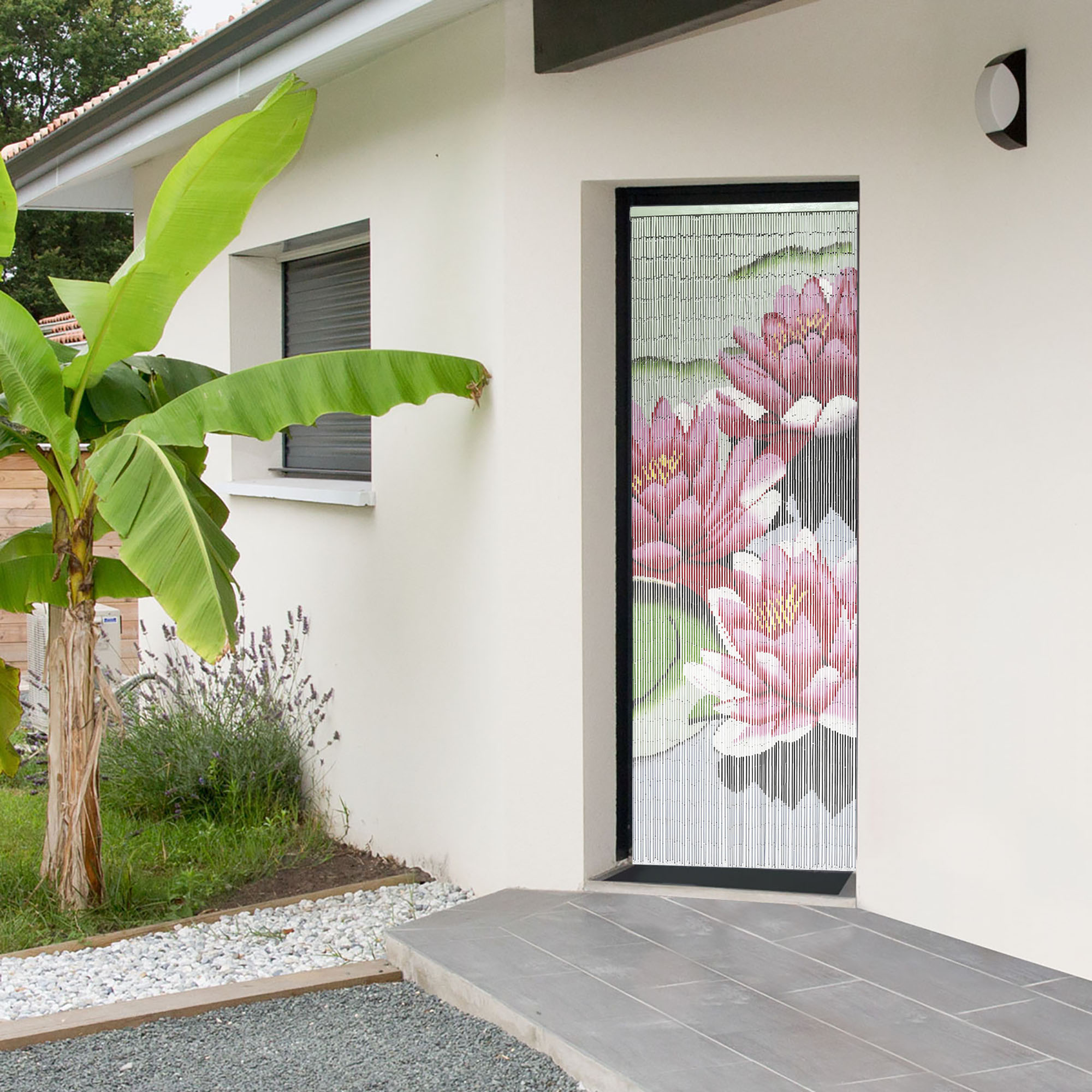 A pink lotus bamboo beaded curtain hanging on an exterior doorway, adding a decorative and functional touch to an outdoor entrance.