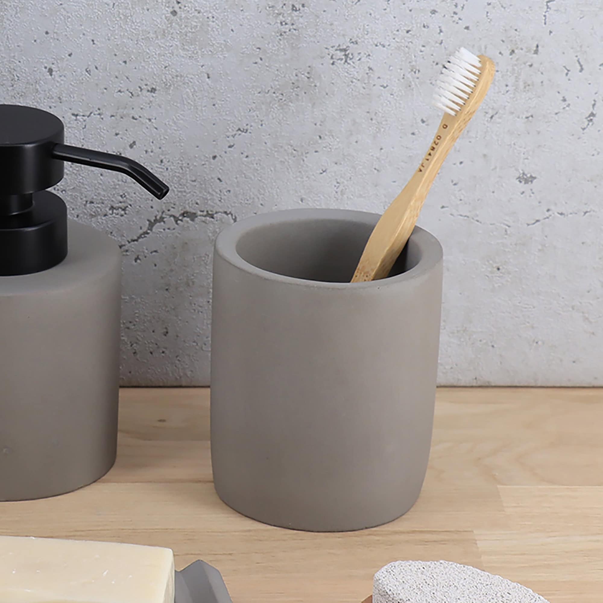 Gray bathroom set featuring a toothbrush holder