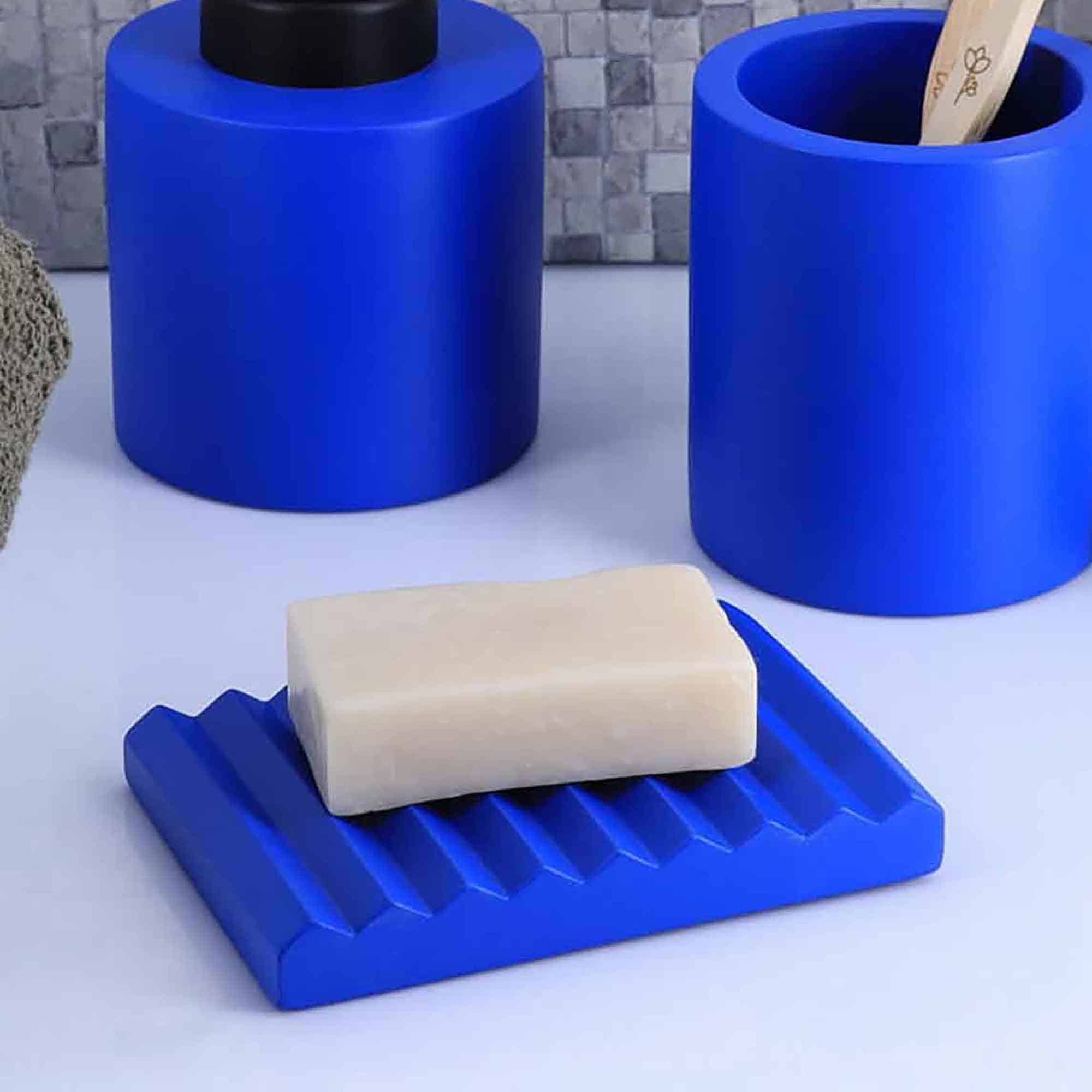 Bathroom Set with Soap Dish: Blue soap dish with matching accessories.