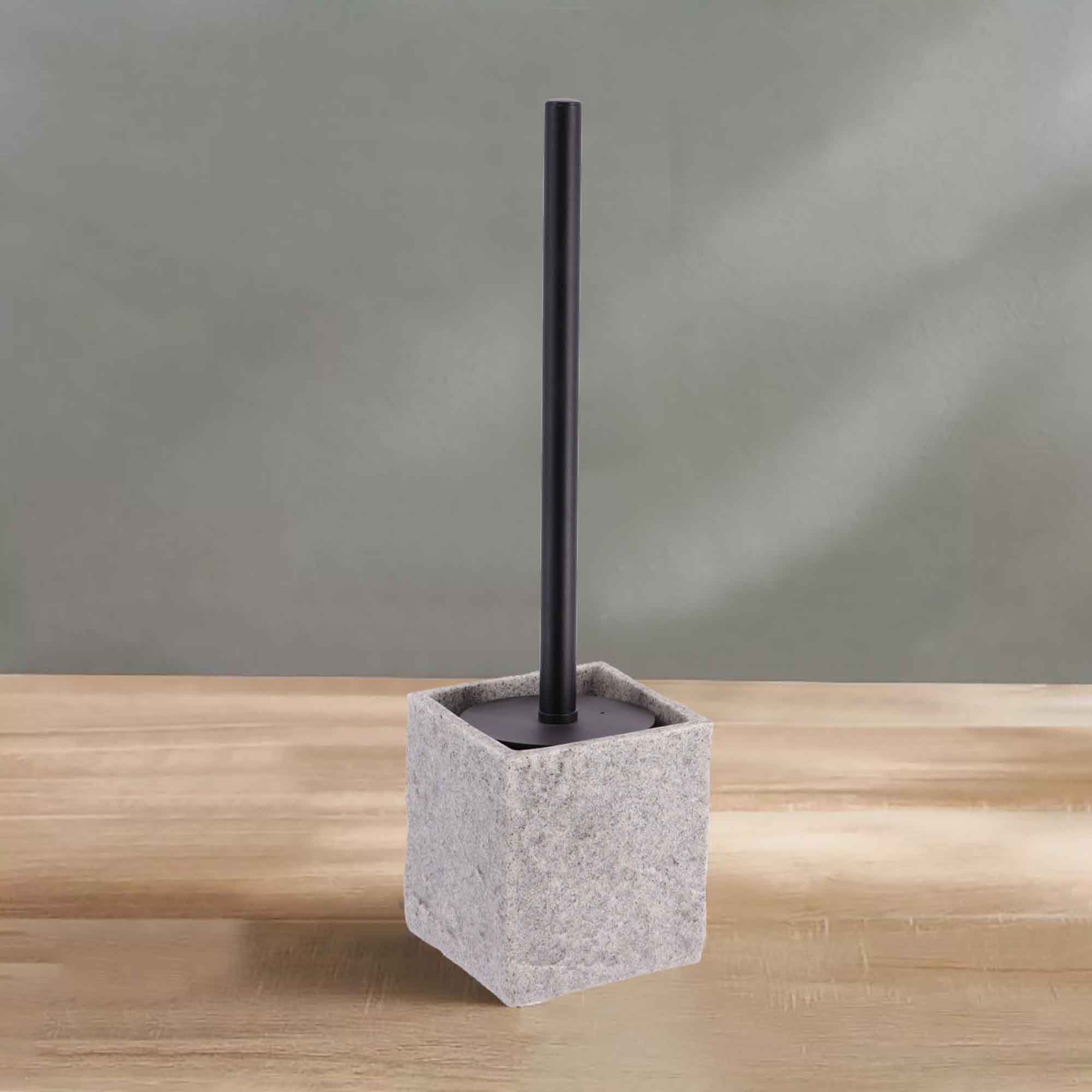 Gray stone effect toilet brush holder on wooden surface