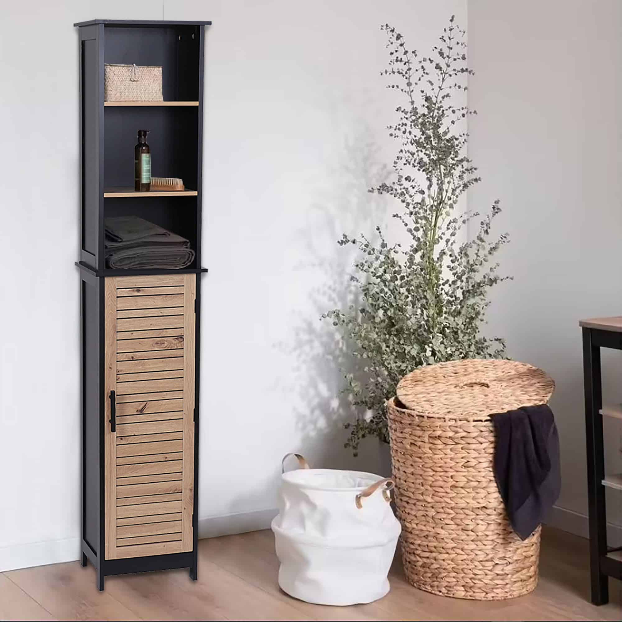 The cabinet in a cozy room setting, next to woven baskets and decorative greenery.