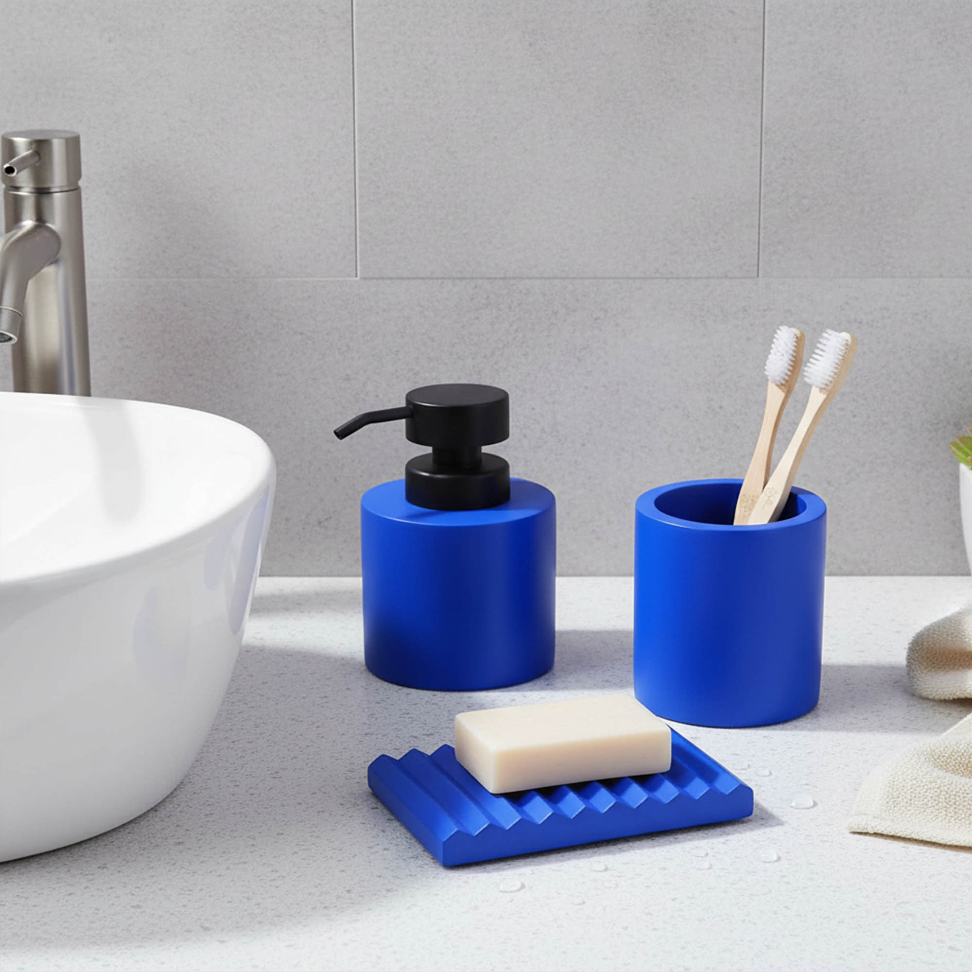 Blue bathroom accessory set on sink with soap dispenser tumbler soap dish