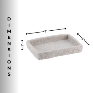 A gray stone-effect soap dish displayed alongside matching bathroom accessories, including a tumbler and a dispenser, on a countertop.