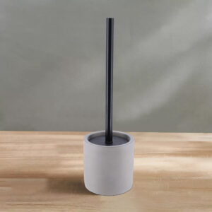 Minimalist Brush Holder: Gray toilet brush holder on a clean surface.
