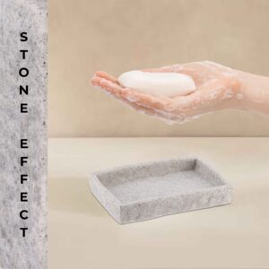 A gray stone-effect rectangular soap dish holding a bar of soap, complementing a modern bathroom decor with a clean and minimalist style.