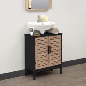 A bathroom setup with the cabinet under a white basin sink. The countertop holds toiletries, towels, and decor.