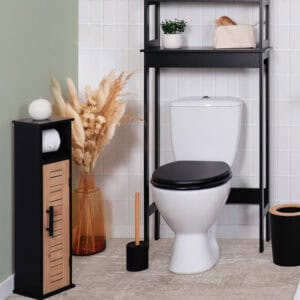 "Bergen toilet paper cabinet with louvered door displayed in styled bathroom with over-toilet shelf"