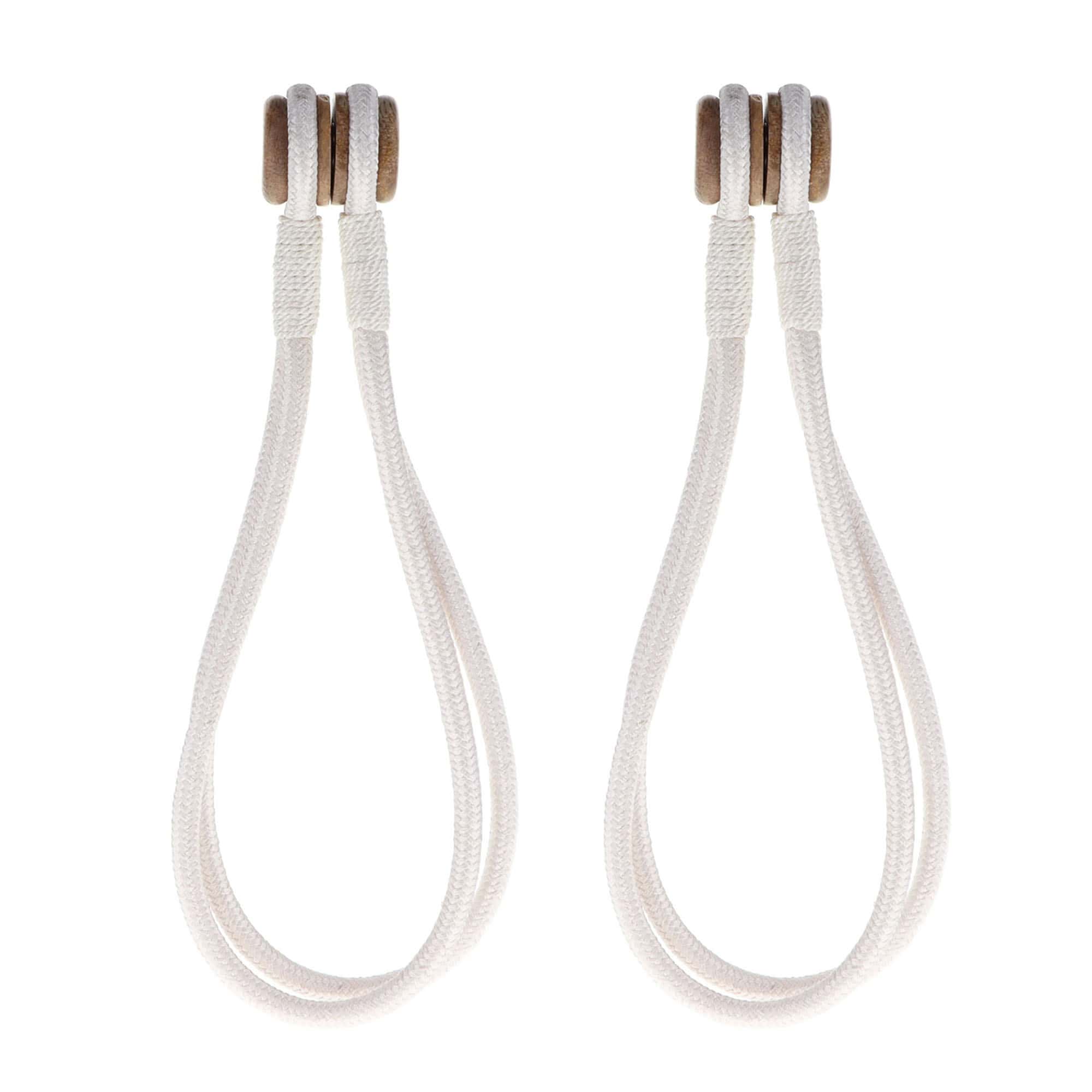 Pair of white magnetic curtain tiebacks with wooden tips