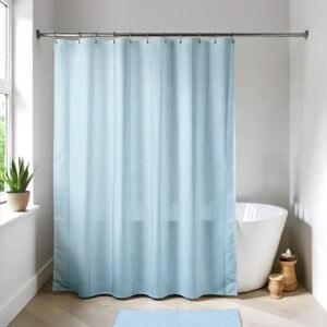 Light blue shower curtain in a bright modern bathroom