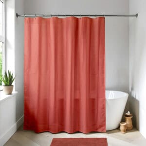 Terracotta shower curtain in a bright modern bathroom