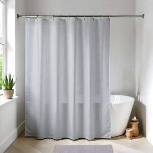 Light gray shower curtain in a bright modern bathroom