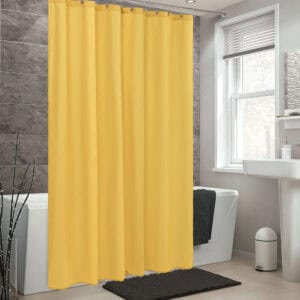Mustard yellow shower curtain in a contemporary bathroom