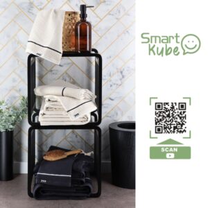 Smart Kube Stackable Storage for Home and Decor – A stylish storage setup with stacked black bamboo cubes holding folded towels and decorative items, with a QR code for more product details.
