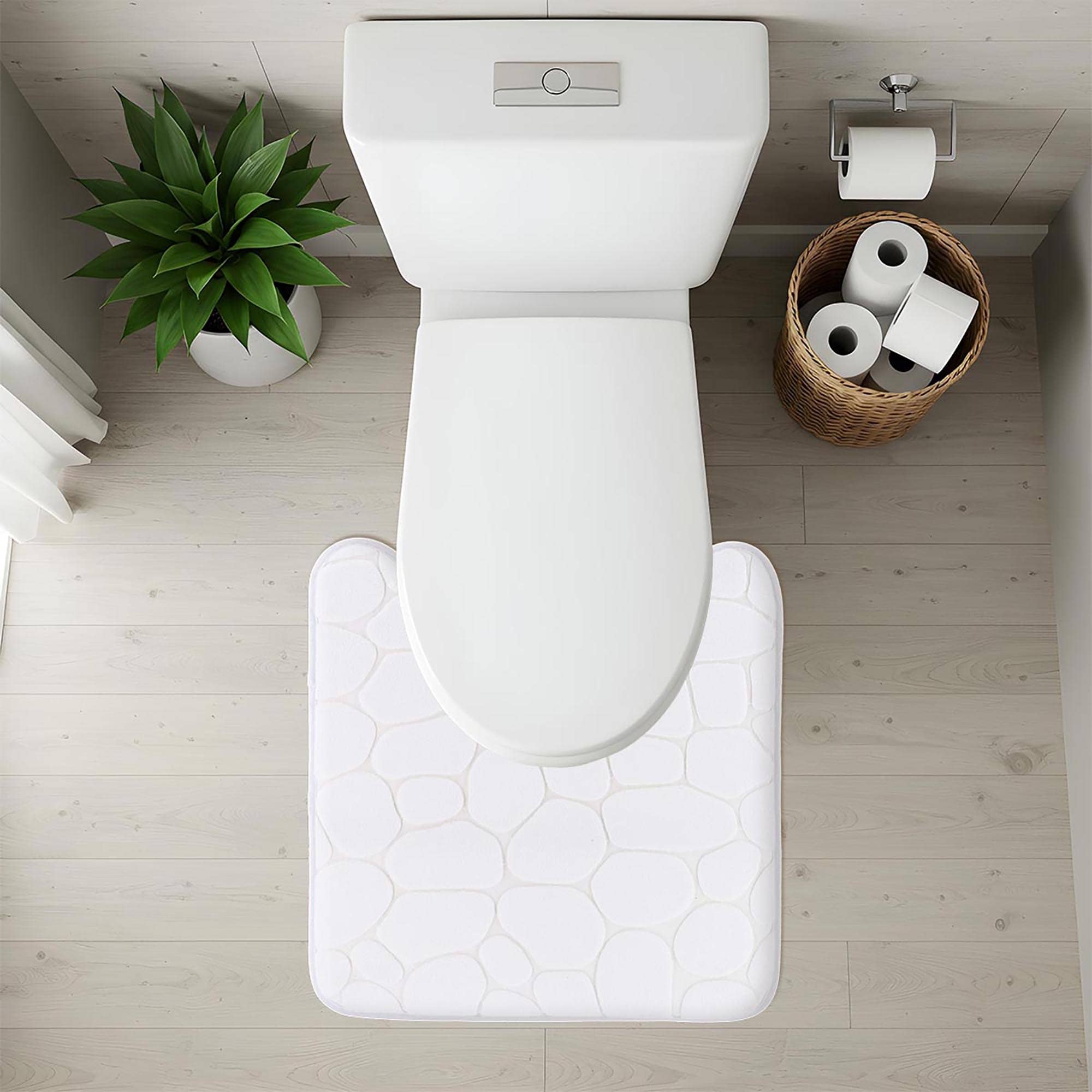 Top-down view of white pebble-texture contour mat fitted around toilet base