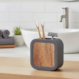 Gray bamboo toothbrush holder with toothbrushes near sink