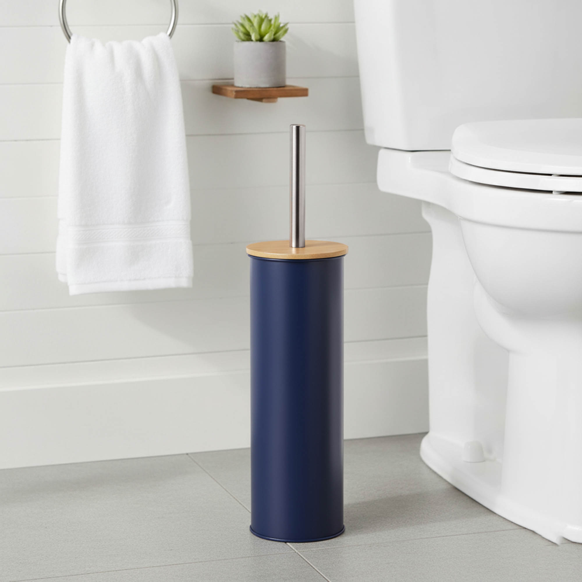 "Modern navy blue toilet brush with bamboo top and stainless steel handle in bathroom"