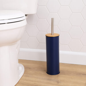 "Navy blue toilet brush holder with bamboo lid and steel handle beside white toilet"
