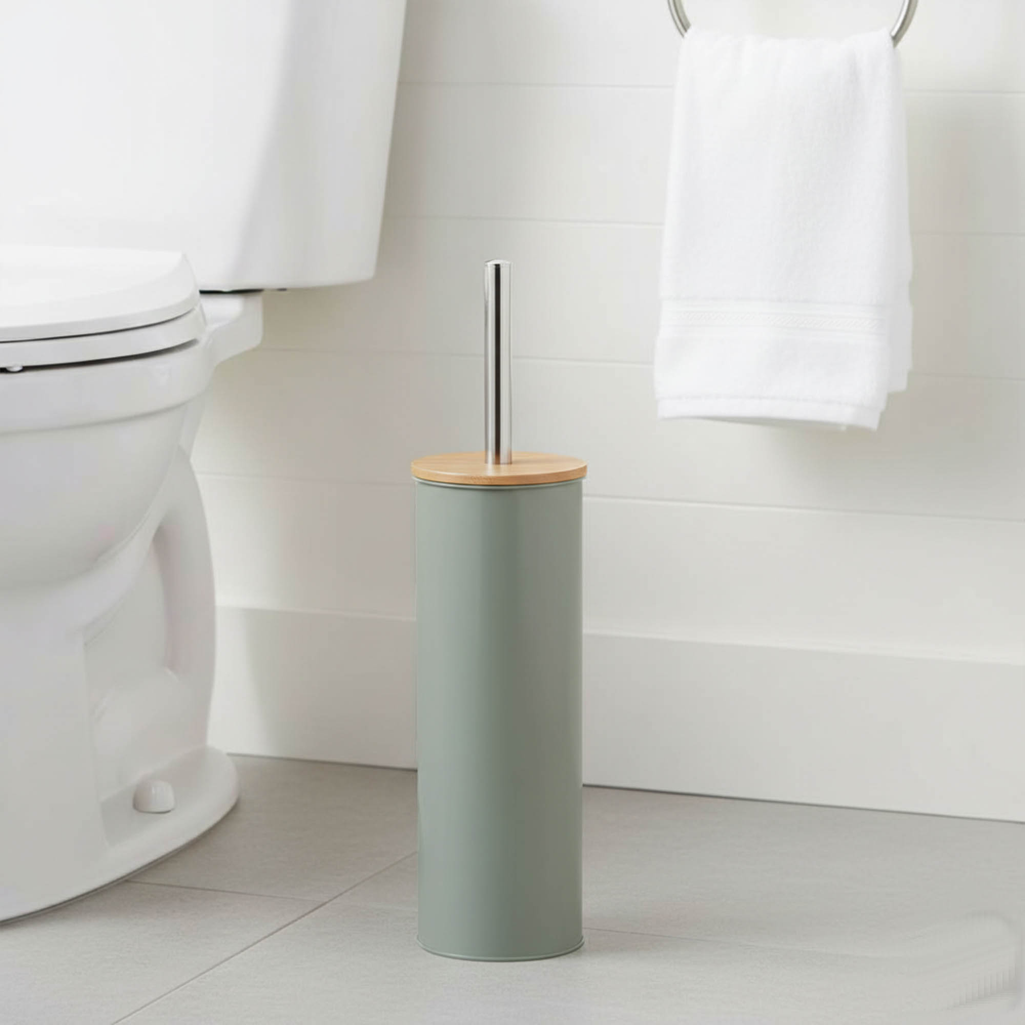 "Modern sage green toilet brush with bamboo top and stainless steel handle in bathroom"