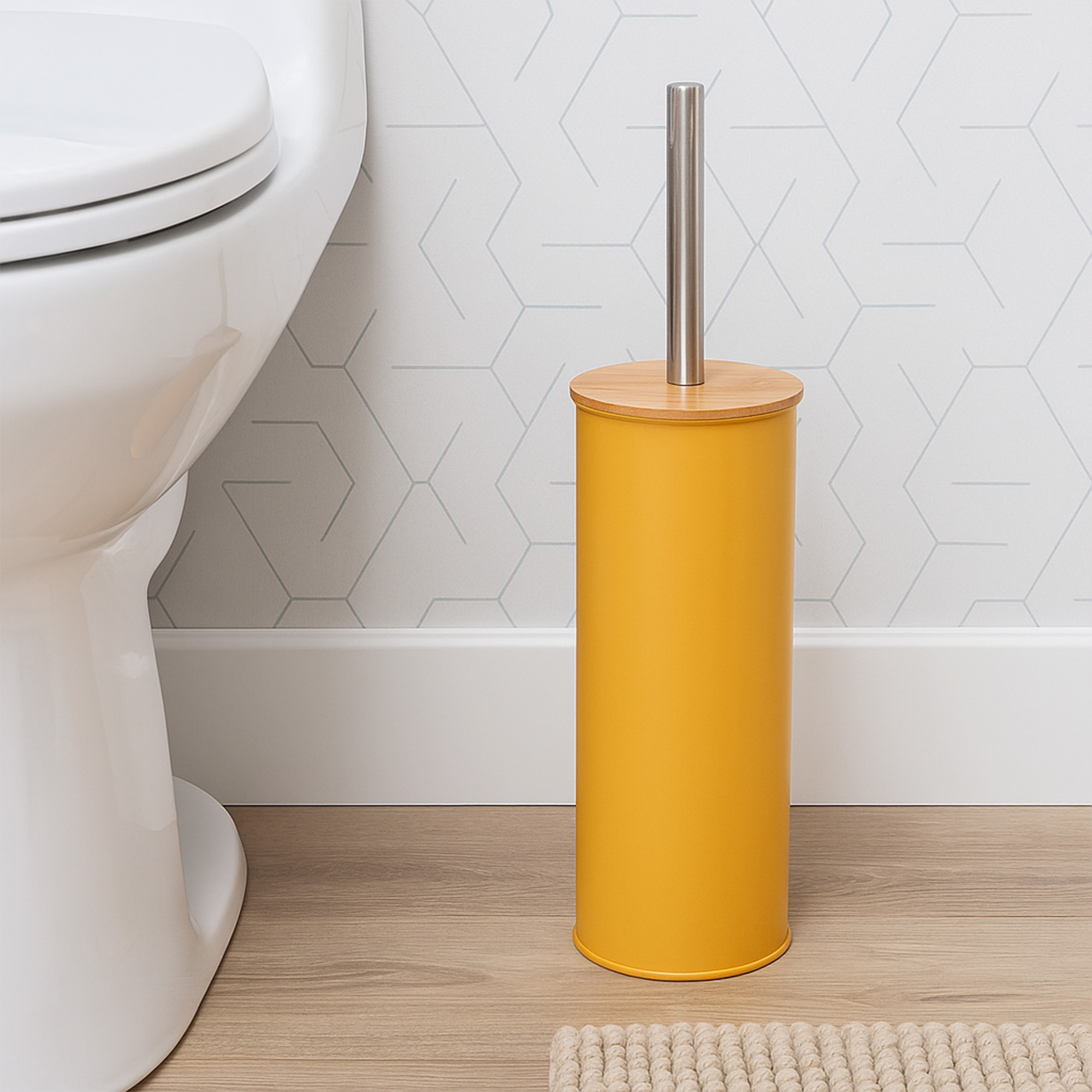 "Mustard yellow toilet brush holder with bamboo lid and steel handle beside white toilet"