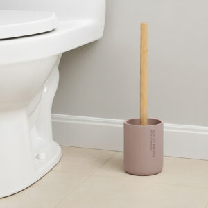 Cappuccino toilet brush with bamboo handle in matching holder placed beside toilet