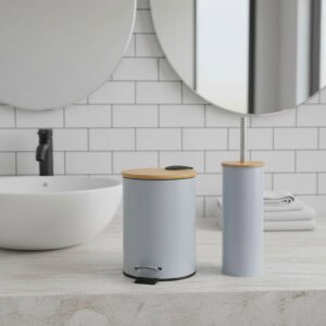 “Light blue trash can and toilet brush with bamboo lids on bathroom counter”