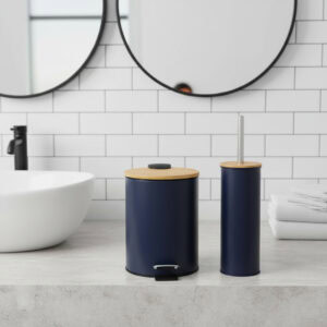 Navy blue trash can and toilet brush with bamboo lids on bathroom counter