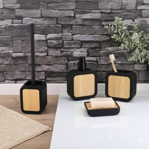 Black bathroom accessory set with bamboo accents including toilet brush, soap dispenser, tumbler, and soap dish