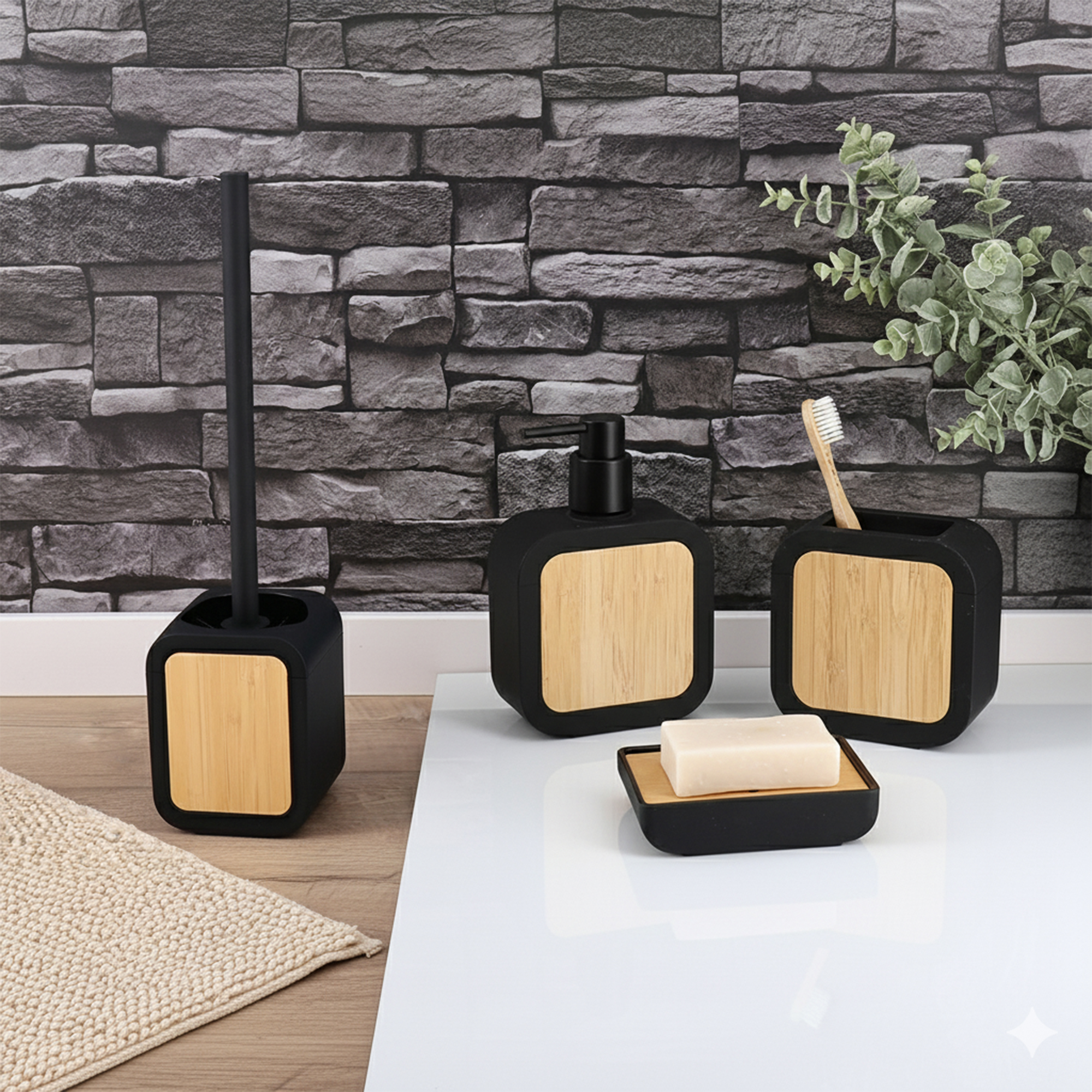 Black bathroom accessory set with bamboo accents including dispenser, tumbler, soap dish, and toilet brush on countertop