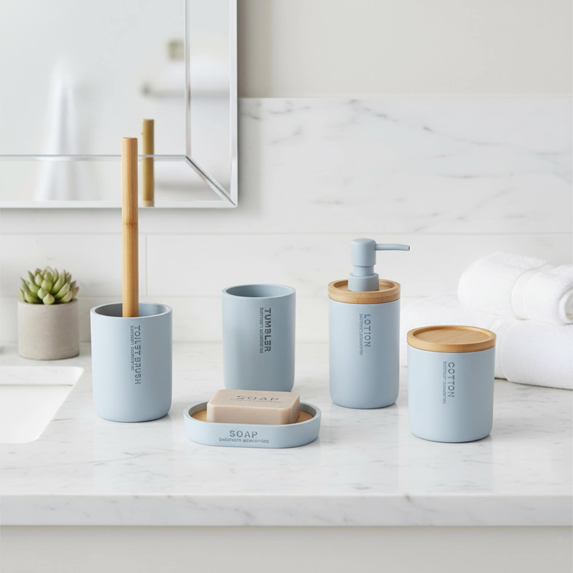 Light blue bathroom accessory set with bamboo lids and dispenser displayed on marble countertop