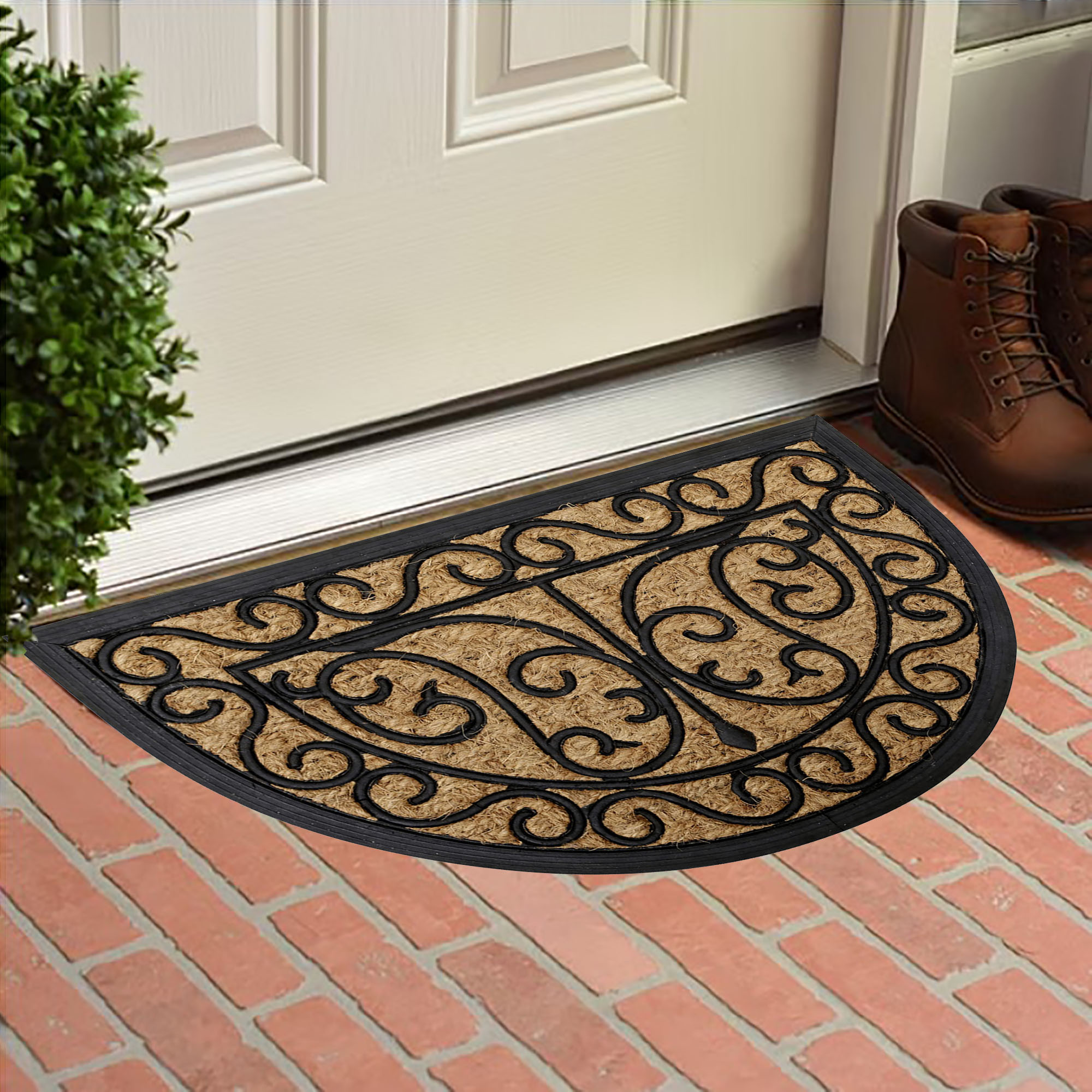 Decorative coco and rubber doormat placed at front door on brick patio