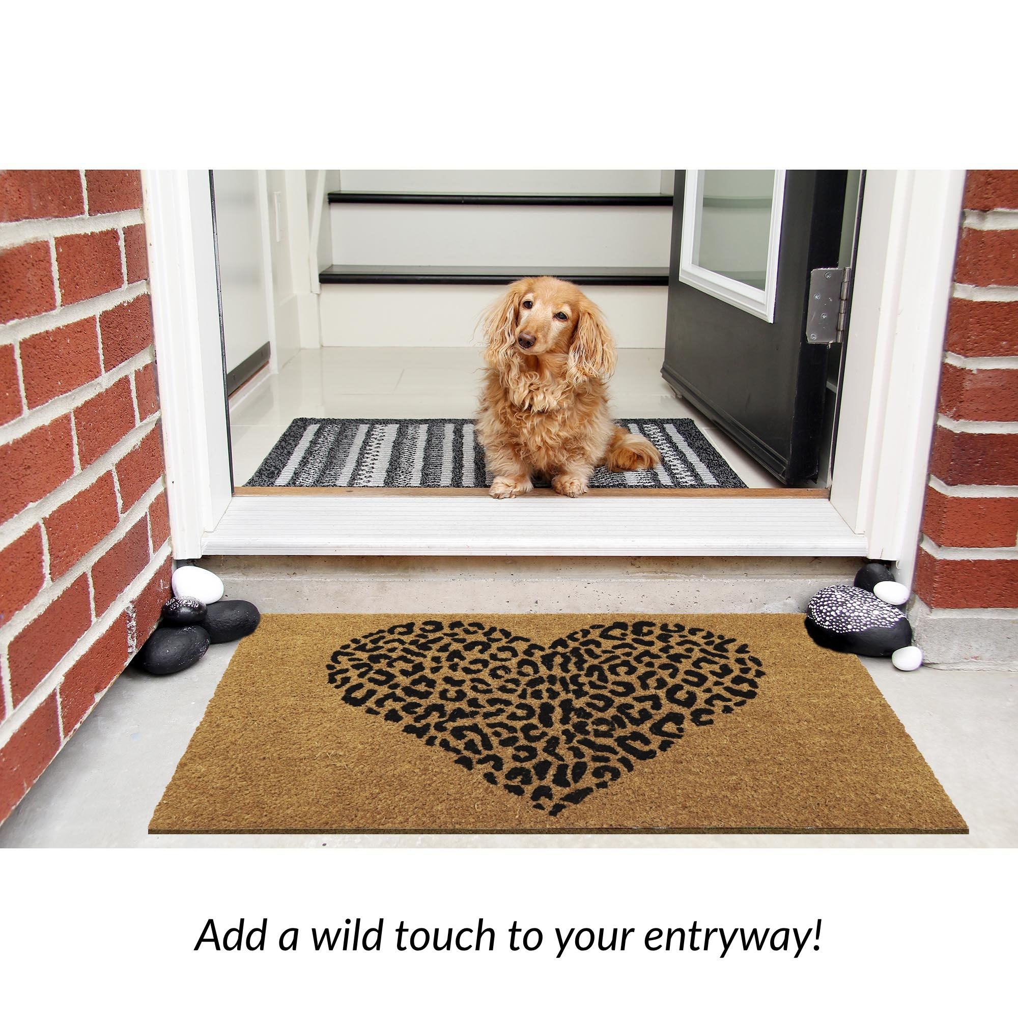 Coir door mat with bold black leopard heart pattern for an animal print-themed entryway