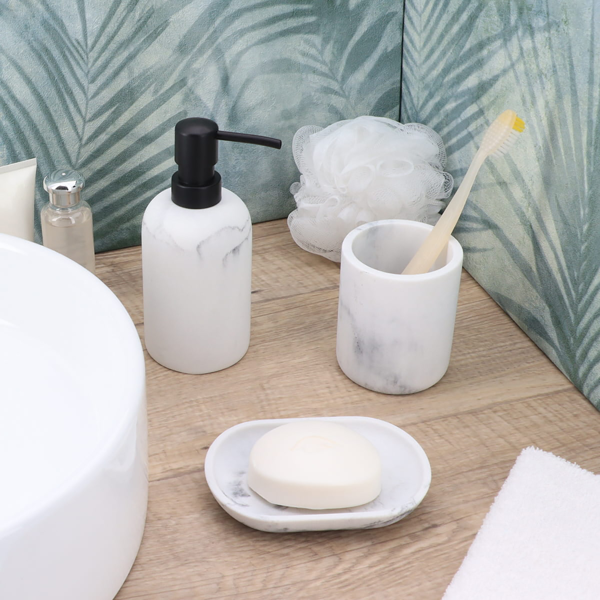 White marble soap dish with matching bathroom accessories