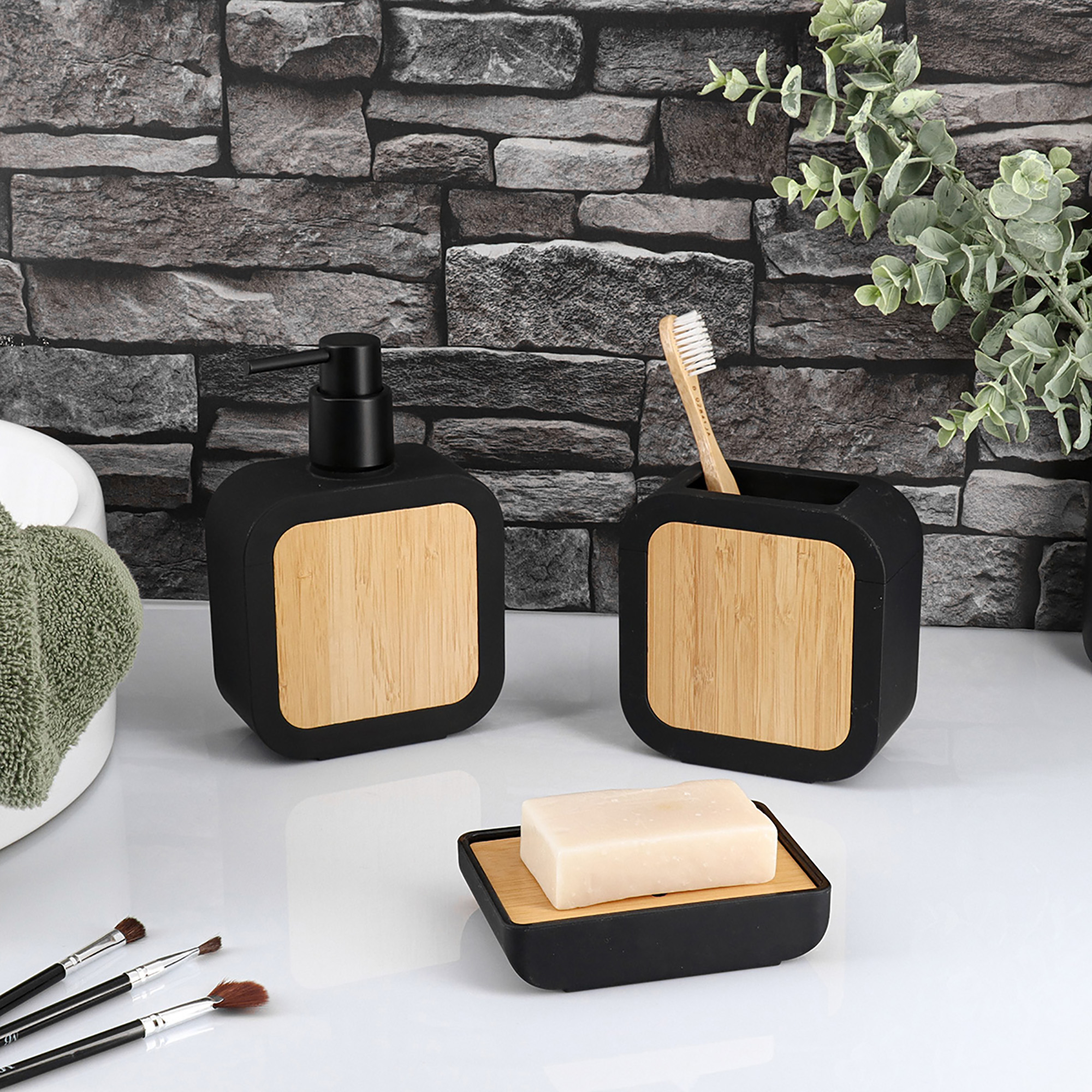 Urban collection set with soap dish, dispenser, and toothbrush holder in black and bamboo finish