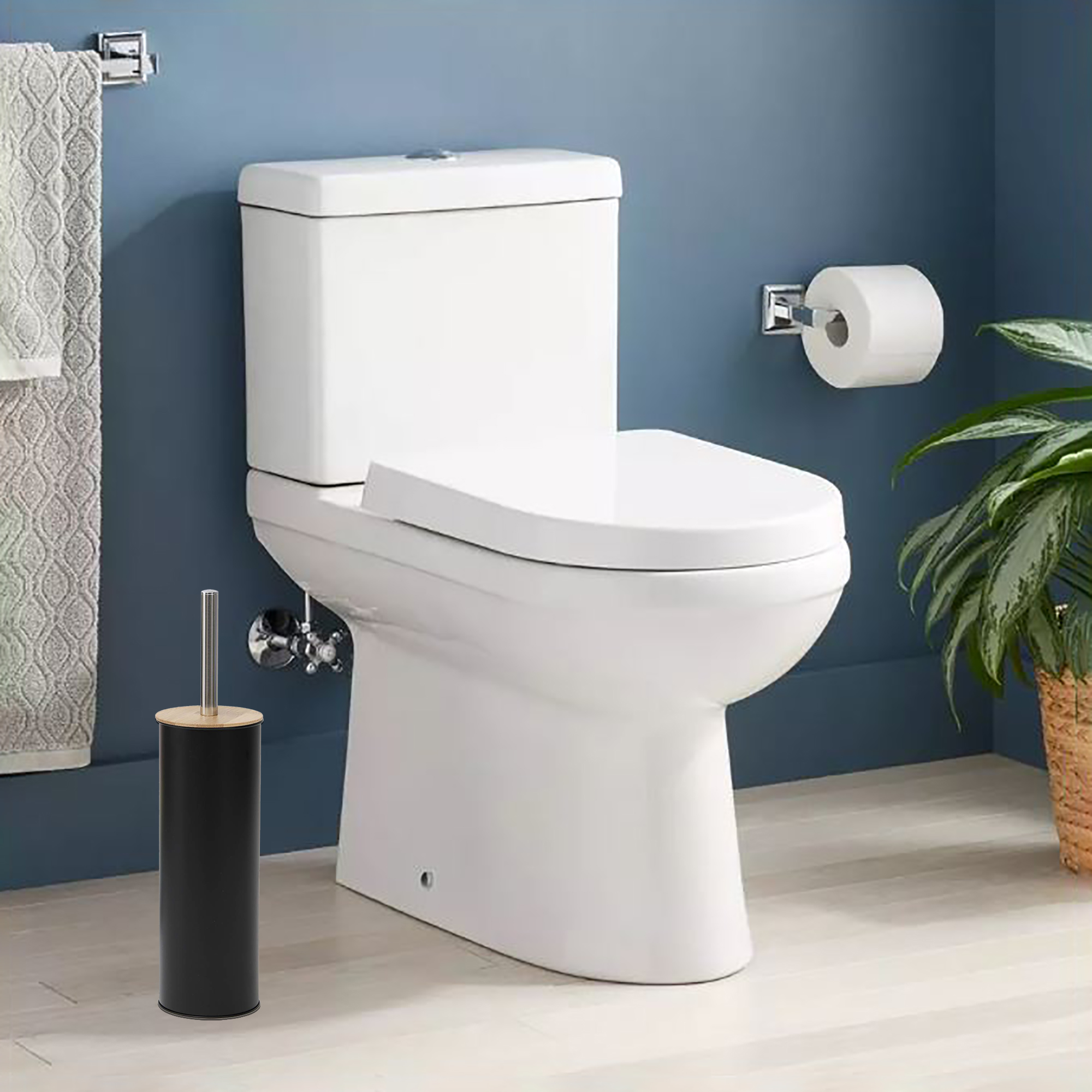 Black toilet brush in clean bathroom with blue walls, next to white toilet