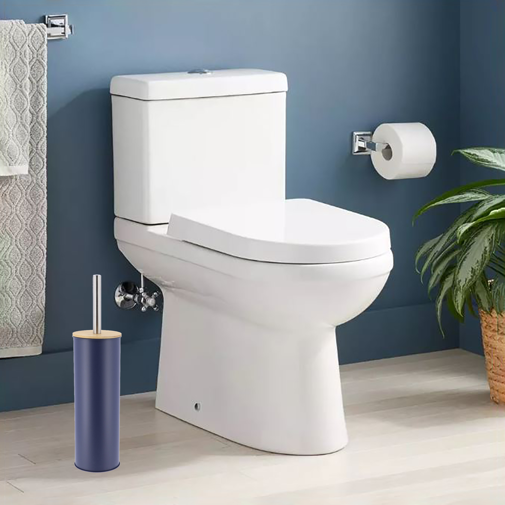 Navy blue toilet brush placed in clean bathroom with blue walls, next to white toilet