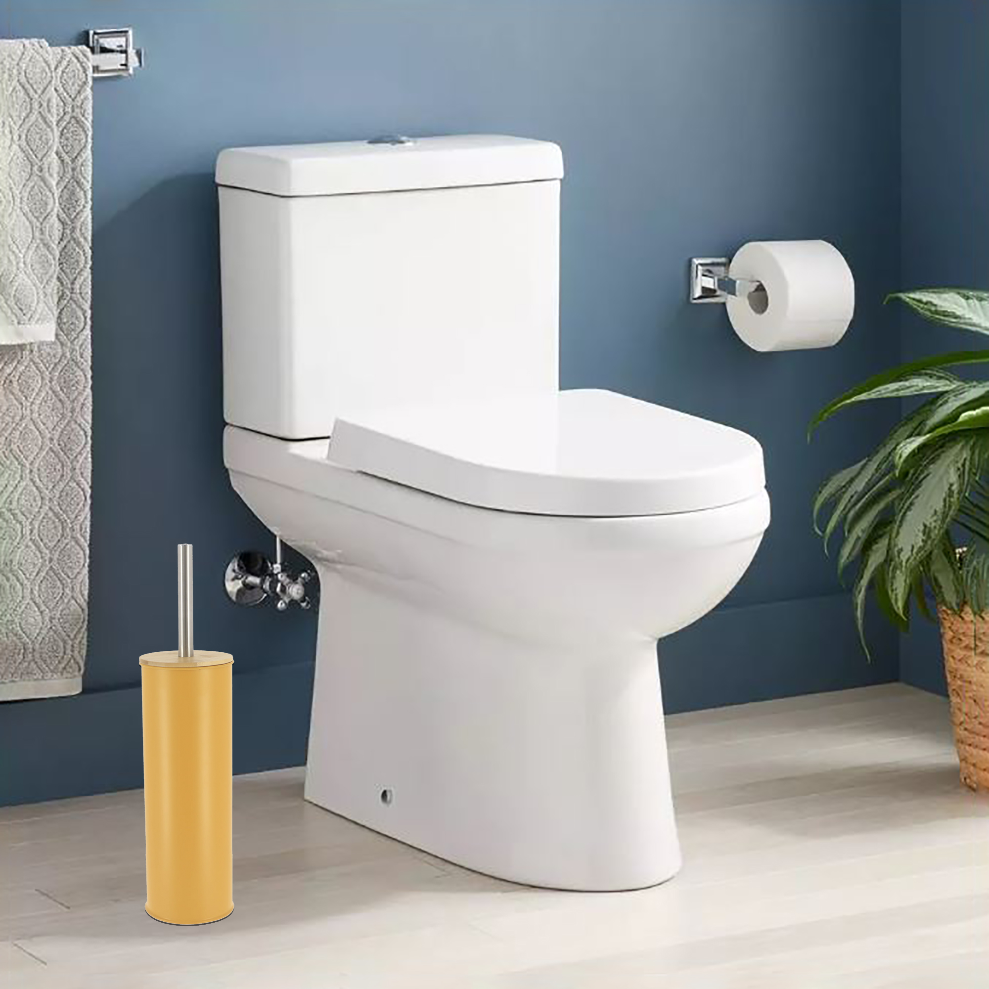 Mustard yellow toilet brush placed in clean bathroom with blue walls, next to white toilet